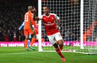LONDON, ENGLAND - DECEMBER 10: Theo Walcott of Arsenal celebrates scoring his sides first goal during the Premier League match between Arsenal and Stoke City at the Emirates Stadium on December 10, 2016 in London, England.  (Photo by Clive Rose/Getty Images)